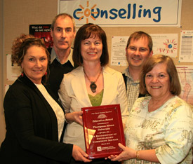 Iris Rich-McQuay from COPE/MECCA, David Lidster and Cliff Robinson, Counselling, Kathy Mitchell, Student Development accept the the 2010 KamFest Award from Shelly Trudeau, Canadian Mental Health Association.    