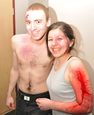 Theatre students Michael Hogg and Allyson Fisher show off their wounds following a mock disaster for students in Health Sciences 383.