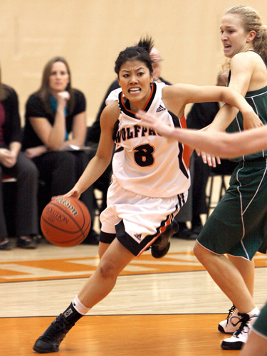 Jen Ju, point guard, carries the ball up the floor in Women's Basketball action. Jen is a second year Journalim student at TRU.