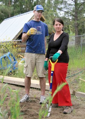 Coby Fulton (left) and Sarah Gibson of TRU Career Education, plot their next move as they work to completing the edging for a new pathway in the back yard of the Cariboo Childcare daycare.