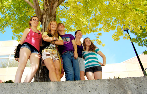 Rebels take a stand underneath a tree on the steps outside the TRU Campus Activity Centre.