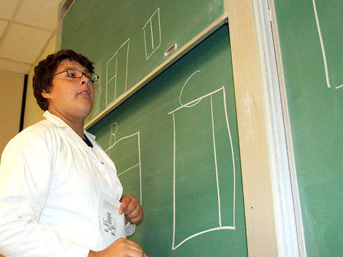 David, of Prince George, at the black board as students discuss their findings following the black box test. Pictured on the board are some of the options of how the box was partitioned. 