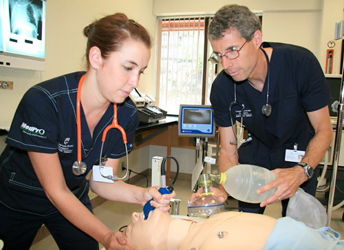 Respiratory therapy students Madeline & Brian re-enact an emergency.