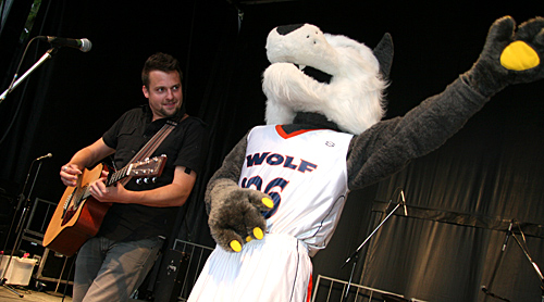 TRU mascot Wolfie demonstrates he's no slouch on air guitar as he pulls off a Pete Townshend windmill during Paul Filek's Mainstage performance. 