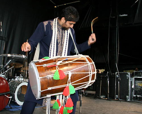 On the Mainstage is Shaun Hunjen playing the dhol (an Indian drum) during the TRU 40th anniversary celebrations.