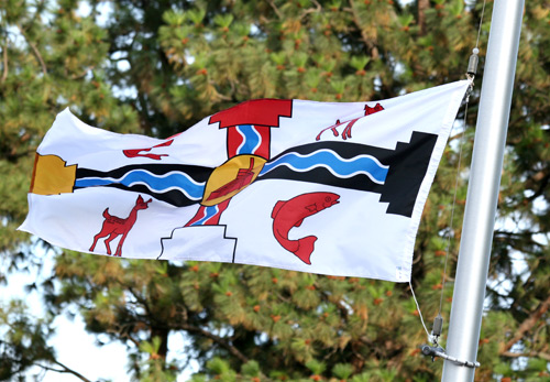 Making its way up the flag pole is the newly created flag honouring the Secwepemc People. TRU is located in the heart of Secwepemc traditional territory.