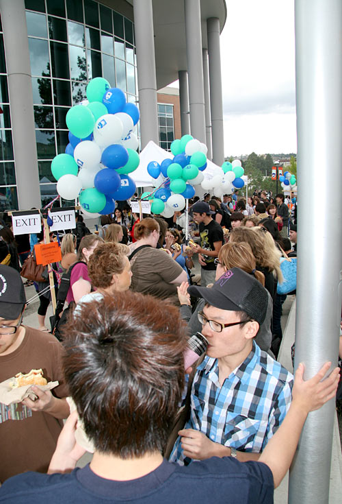 The organized chaos around the burger & hotdog grill during the Back to School BBQ outside the International Building.