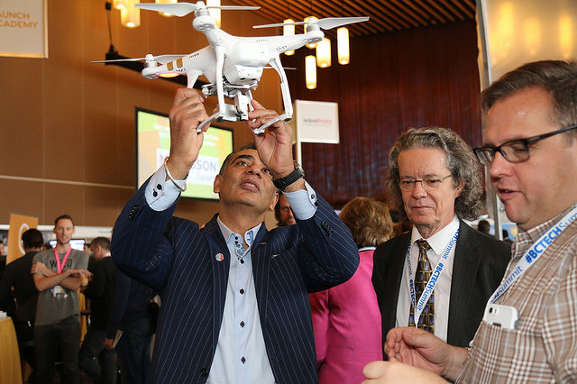Minister of Technology and Citizens Services, Amrik Virk, along with TRU President Dr. Alan Shaver, take an interest in the UAVs being used by Dr. John Church in his precision ranching research project.