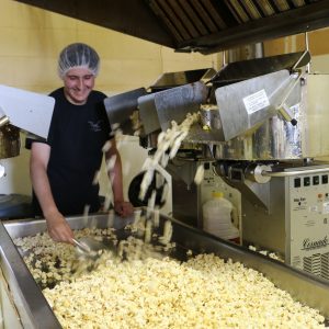 Business grad, Cody Inskip on the popcorn production line.