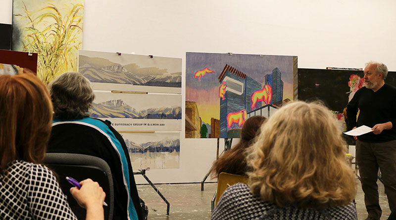 Students and their work during a critique class with Alan Brandoli