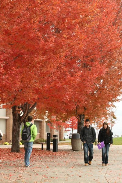 Students walking in front of the Arts & Education building.