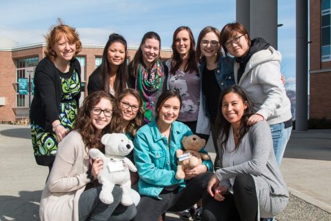 Students ready to depart in May along with School of Nursing adopted bears <i>Kenkeknem</i> and <i>Ckenmim’elt</i>.