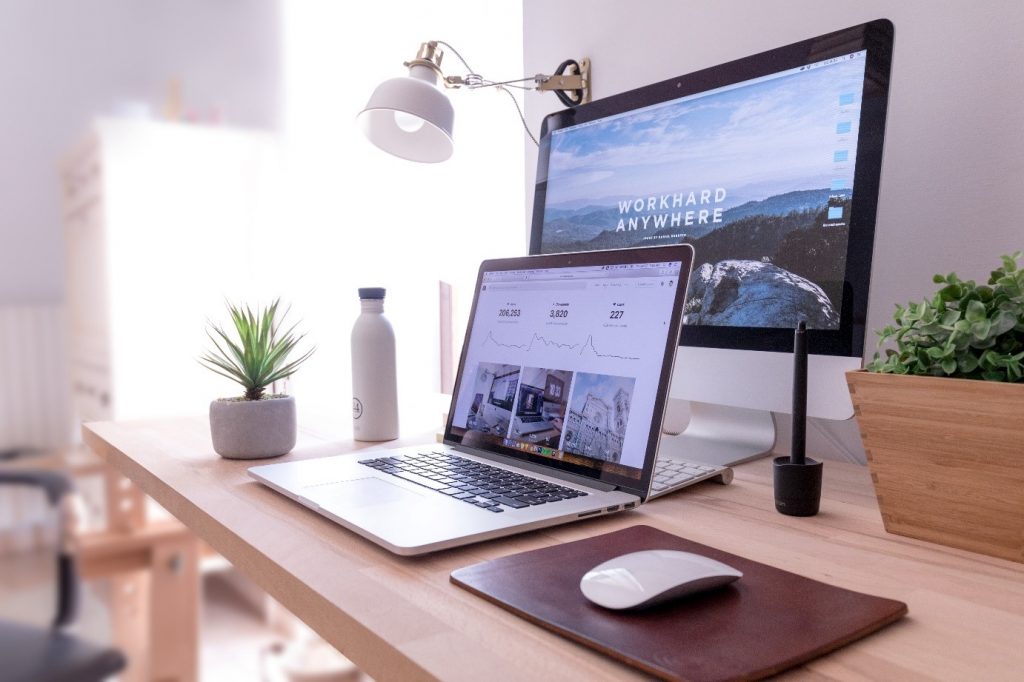 image of desk with two computer screens