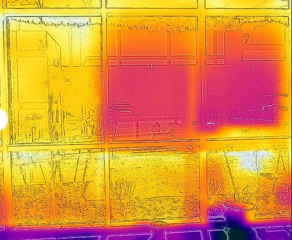 Thermal image of window film samples, taken from inside ECEC, illustrates the film’s ability to reduce the amount of solar heat entering the building. 