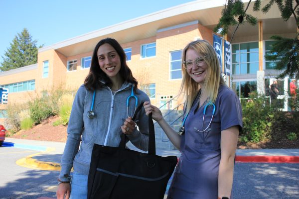 Nursing students Faith Dueck (L) and Kayleigh Jacobson with their lab kits. 