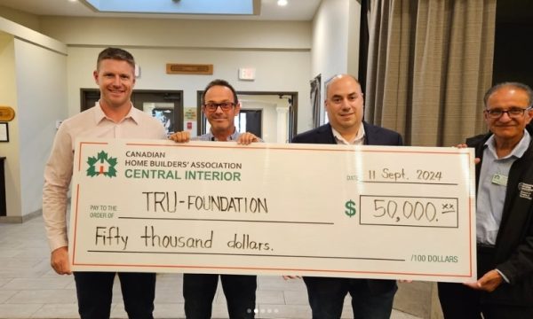 From left to right: CHBA CI President Chris Crowell, past-president Tom Caine and treasurer Mario Piroddi present a $50,000 cheque to TRU Trades and Technology Dean Baldev Pooni to create an endowment in support of trades students. 