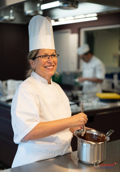 Chef Cristiana Solinas working in a commercial kitchen