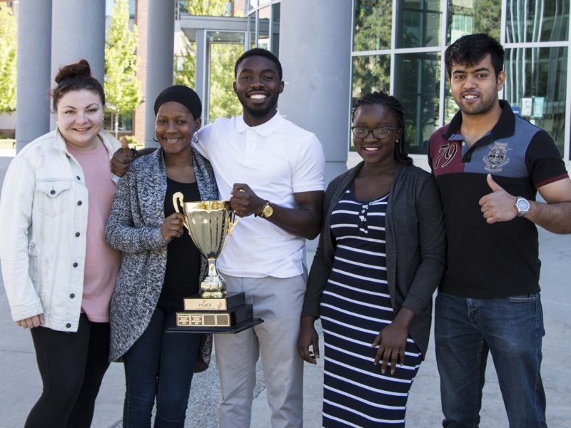 From left to right: MBA students Tanisha Suzuki, Fatimah Abdullahi, Tomi Owoyemi, Jessica Mamman and Himanish Raghunath with the BC MBA Games trophy