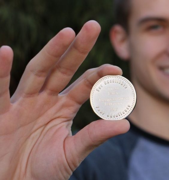 Tyson Bodor holds his CSC Silver Medal.