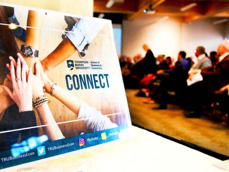 School of Business Connect poster on a table top