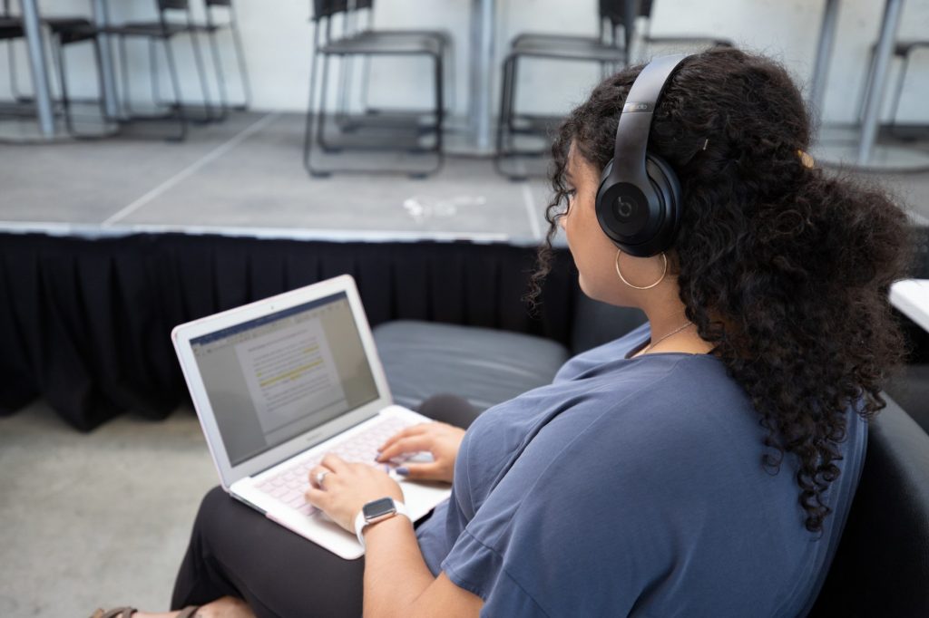 Student studying on laptop.