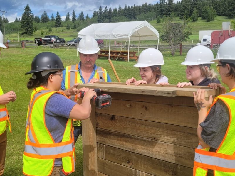 Students from the first Women In Trades Exploratory Program work on a carpentry project for the 108 Mile House Heritage Site.