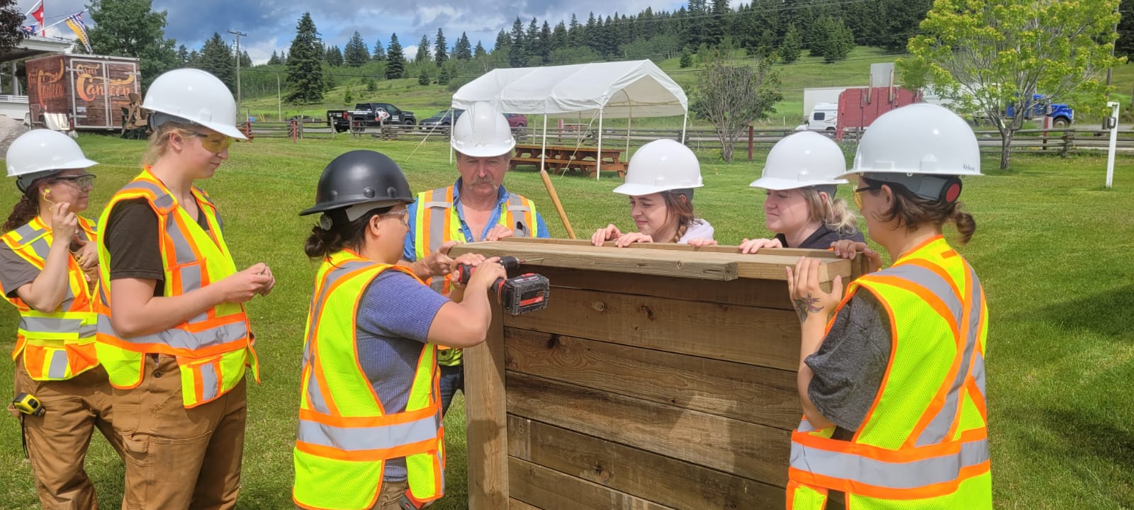Students from the first Women In Trades Exploratory Program work on a carpentry project for the 108 Mile House Heritage Site.