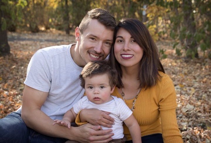 Trevor Tessier with his wife and son