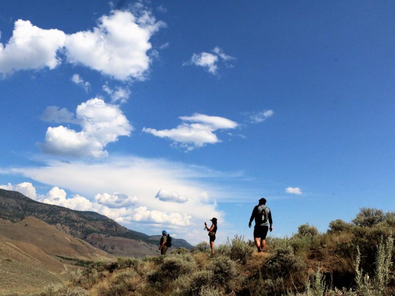 Visitors to McAbee Fossil Beds look over the ancient site, home to a wide variety of fossils.