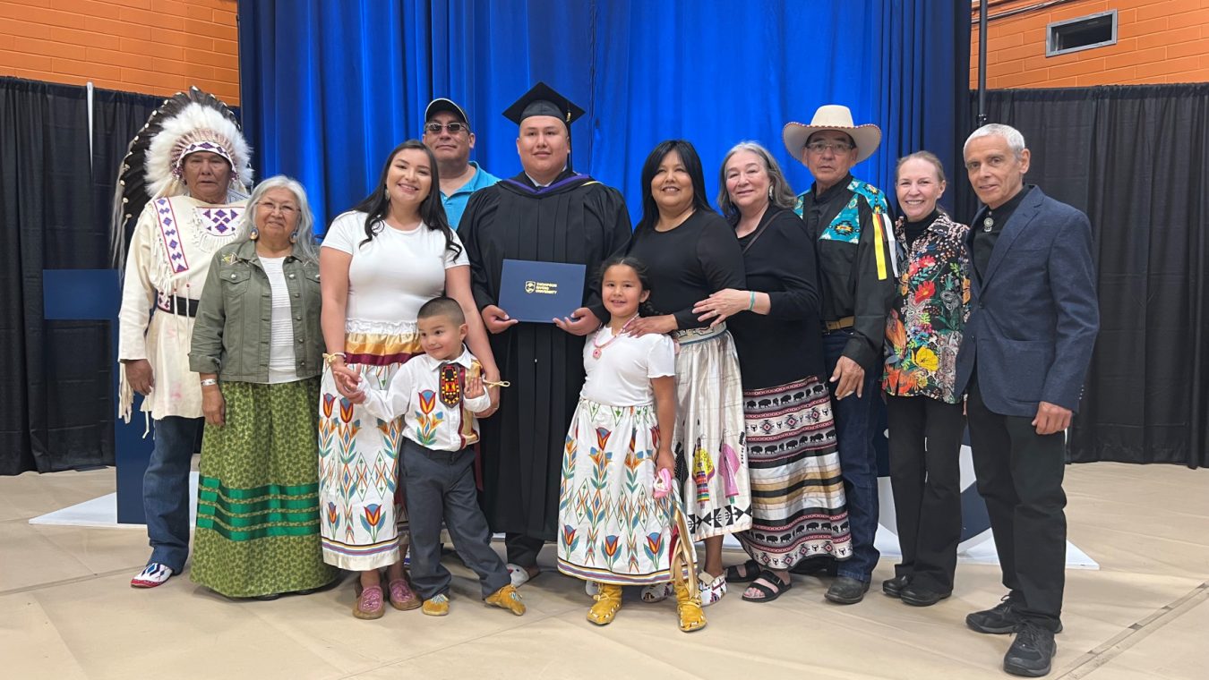 TRU Law alum Darnel Tailfeathers (centre) with family members at convocation in June 2022.