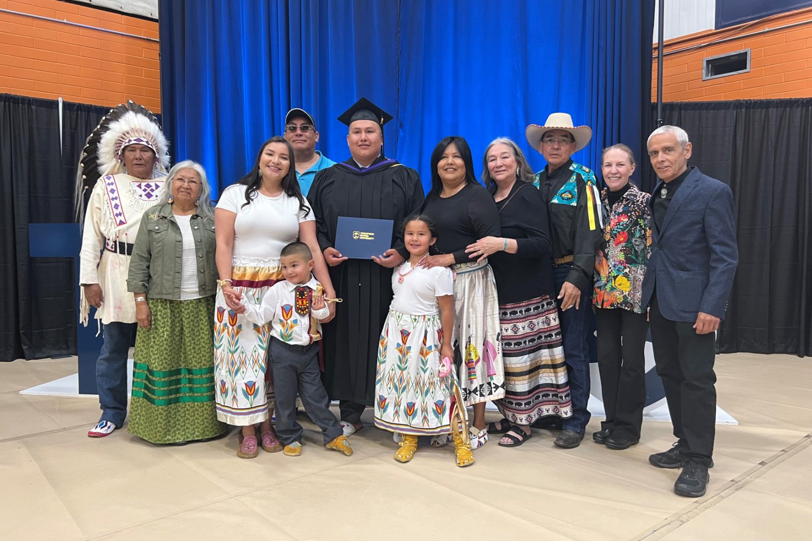 TRU Law alum Darnel Tailfeathers (centre) with family members at convocation in June 2022.