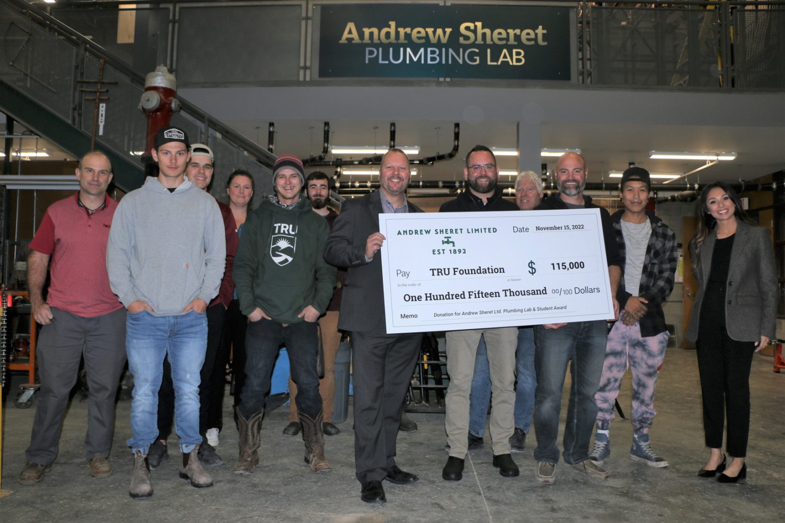 cheque presentation with group of students