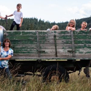 Jamie Collins, prior to his passing, with his wife, Linda, and grandchildren.