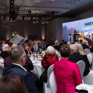 People seated at a Gala fundraising event.