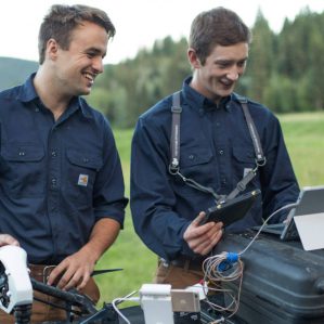 Two men operating a drone