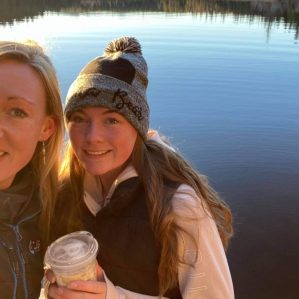 Carmen and Alexis Fenrich take a selfie by a lake.